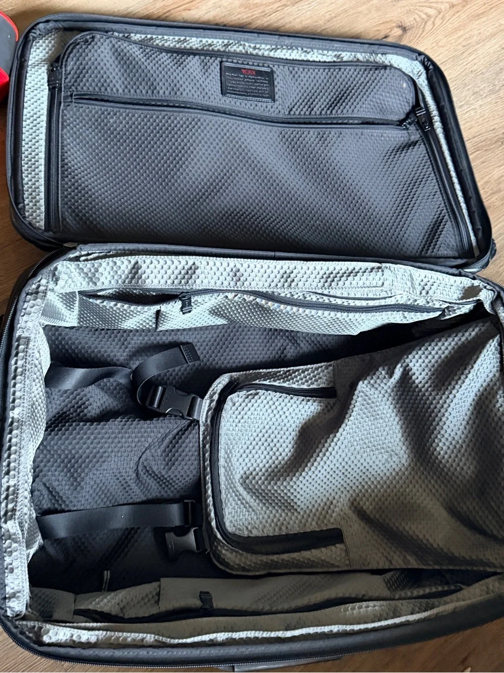 Tumi Black Rolling Suitcase with Front Pocket